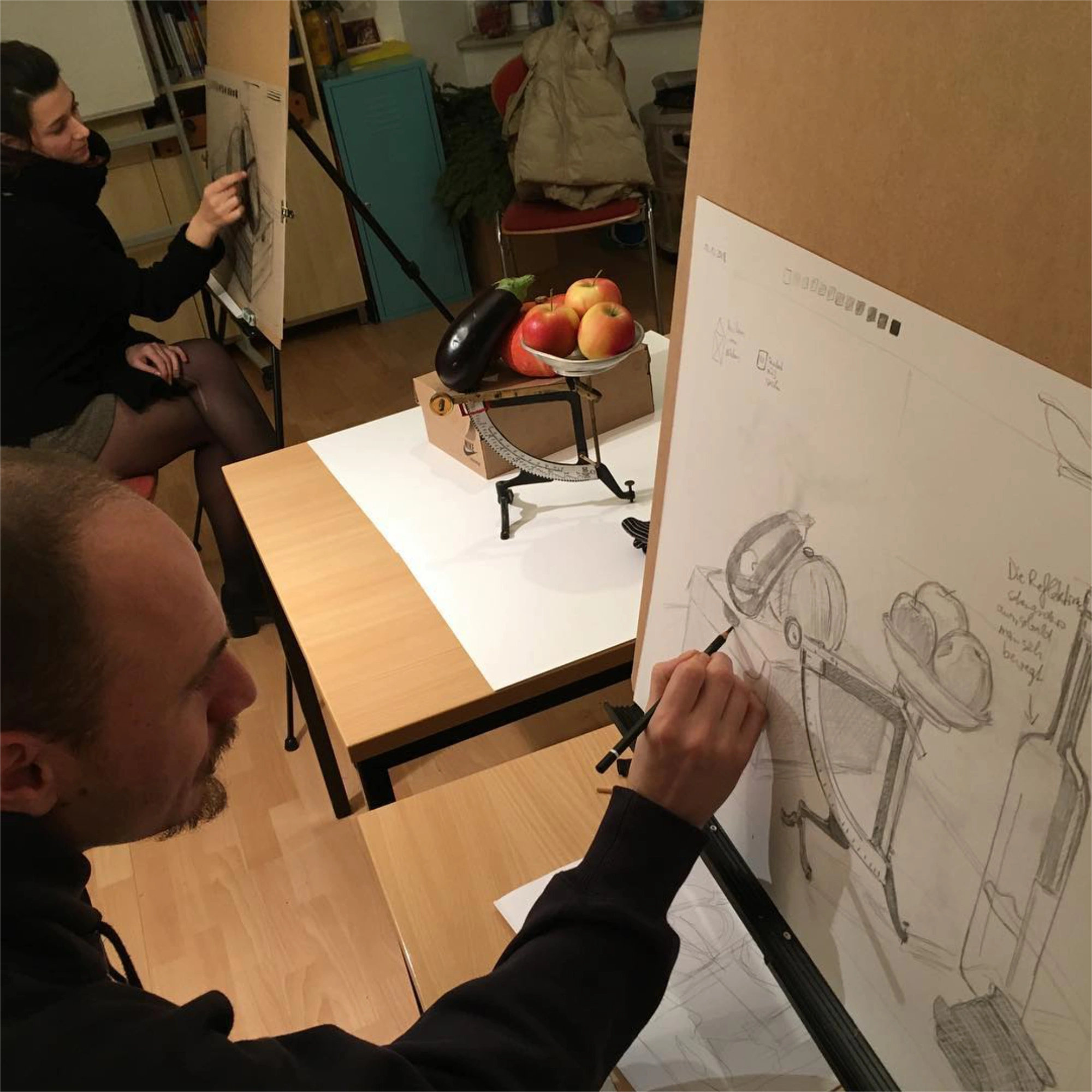 Drawing workshop studio scene with easels and paper