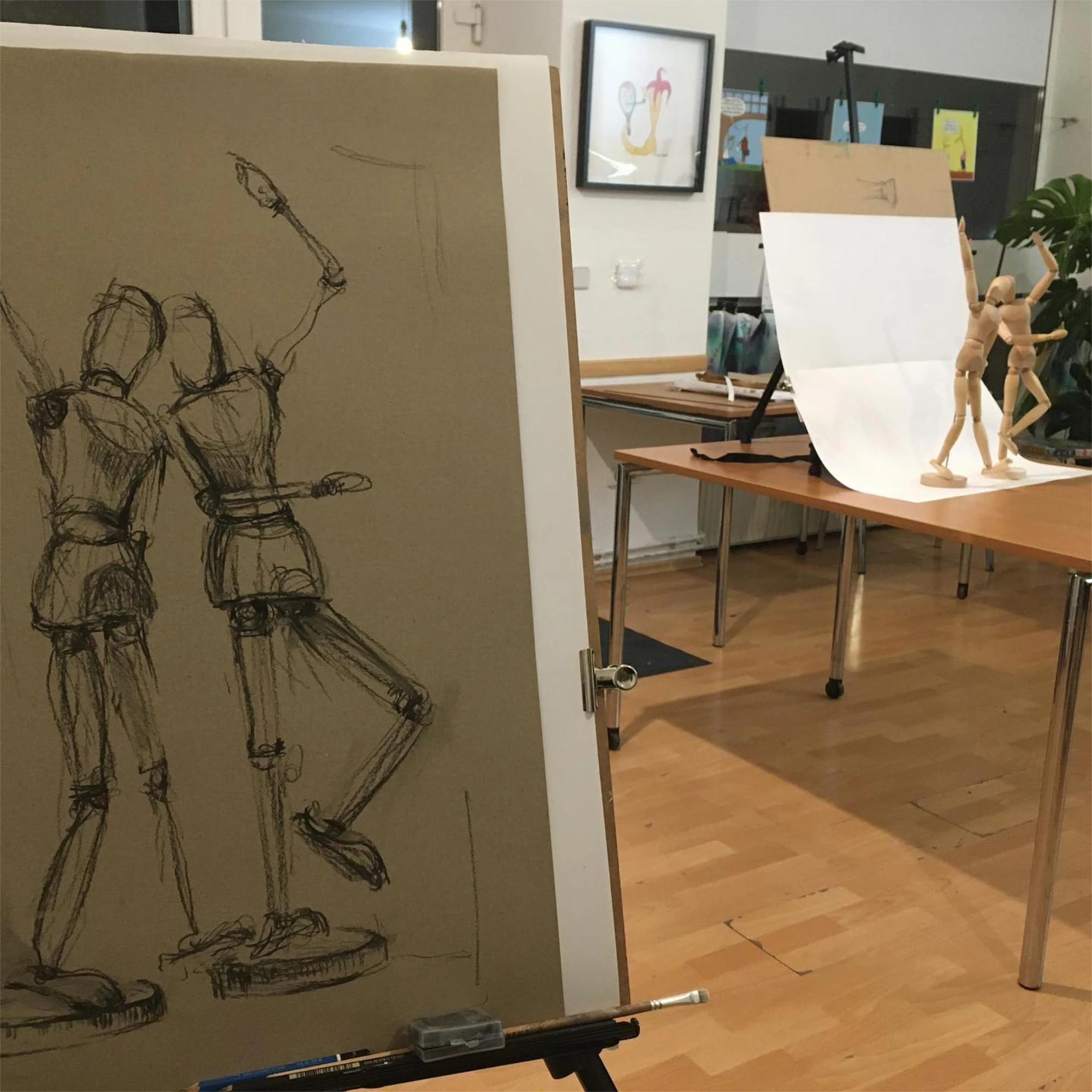 Classroom tables and easels prepared for an art session